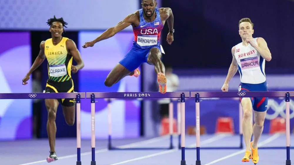 American Rai Benjamin beats world-record-holder Karsten Warholm for gold in 400-meter hurdles