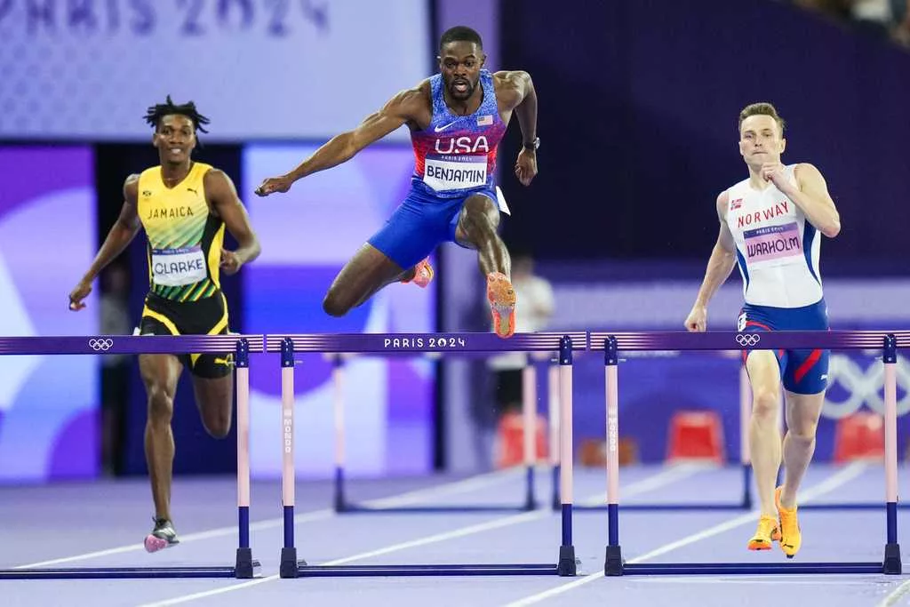 American Rai Benjamin beats world-record-holder Karsten Warholm for gold in 400-meter hurdles