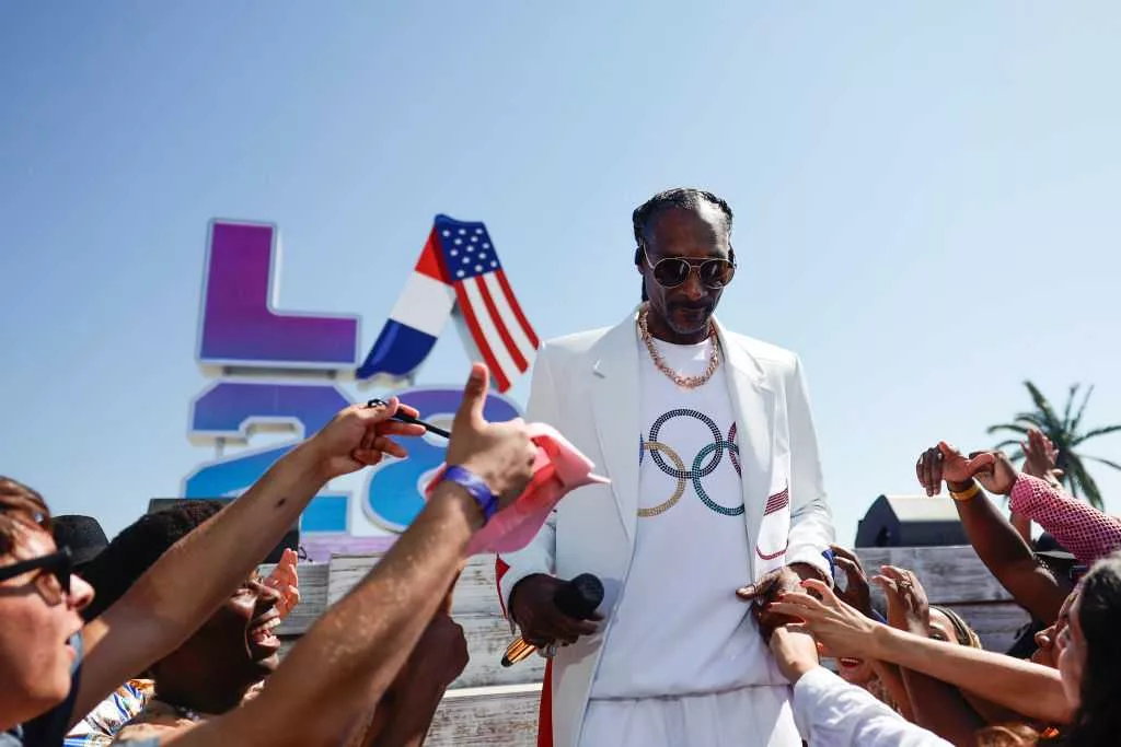 Snoop's side quests: Beyond the Olympics, rapper has proved versatility from cooking to wrestling