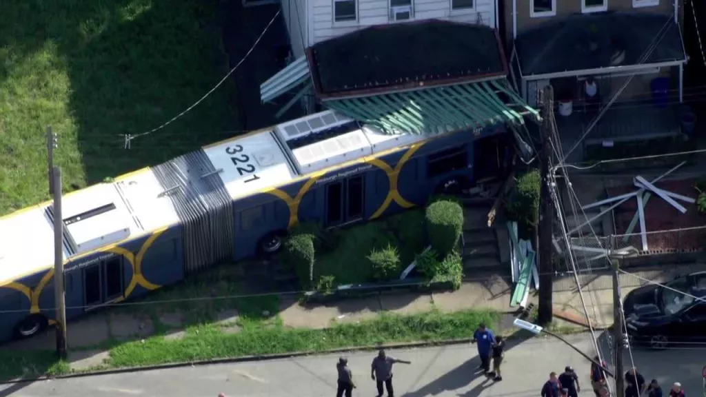 Bus crashes into Pittsburgh home after being hit by vehicle involved in police chase