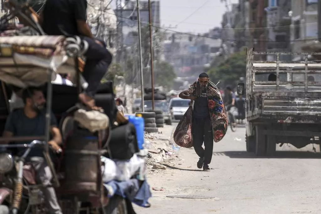 An Israeli airstrike kills 18 members of a family in Gaza as mediators hope for a cease-fire
