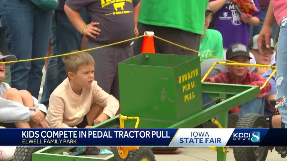 Adorable show of strength: Kids pull up to the Pedal Tractor Pull contest at the Iowa State Fair