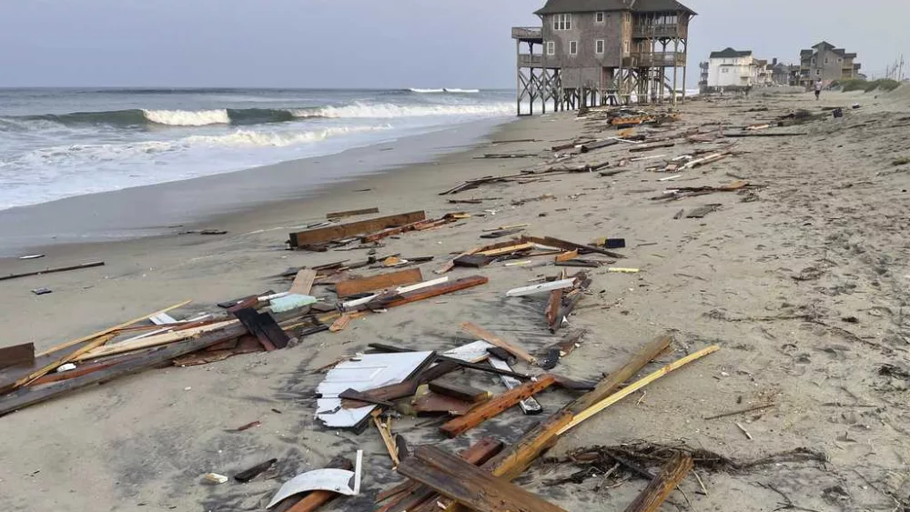 Ernesto gains strength as a hurricane over the open Atlantic