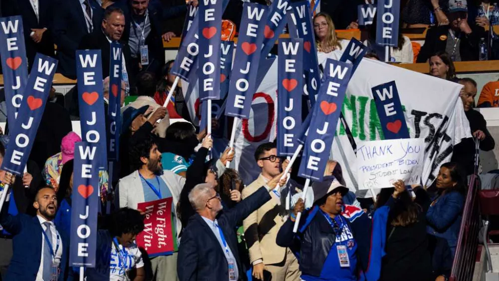 Abandon Biden protesters unveil banner during his DNC speech
