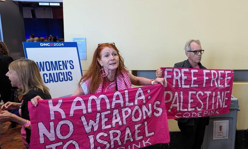 Video: Walz drop-in at DNC Women's Caucus interrupted by protestors