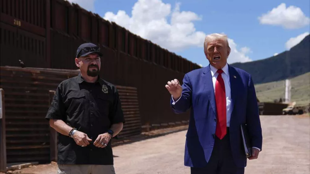 Trump uses a stretch of border wall and a pile of steel beams in Arizona to contrast with Democrats