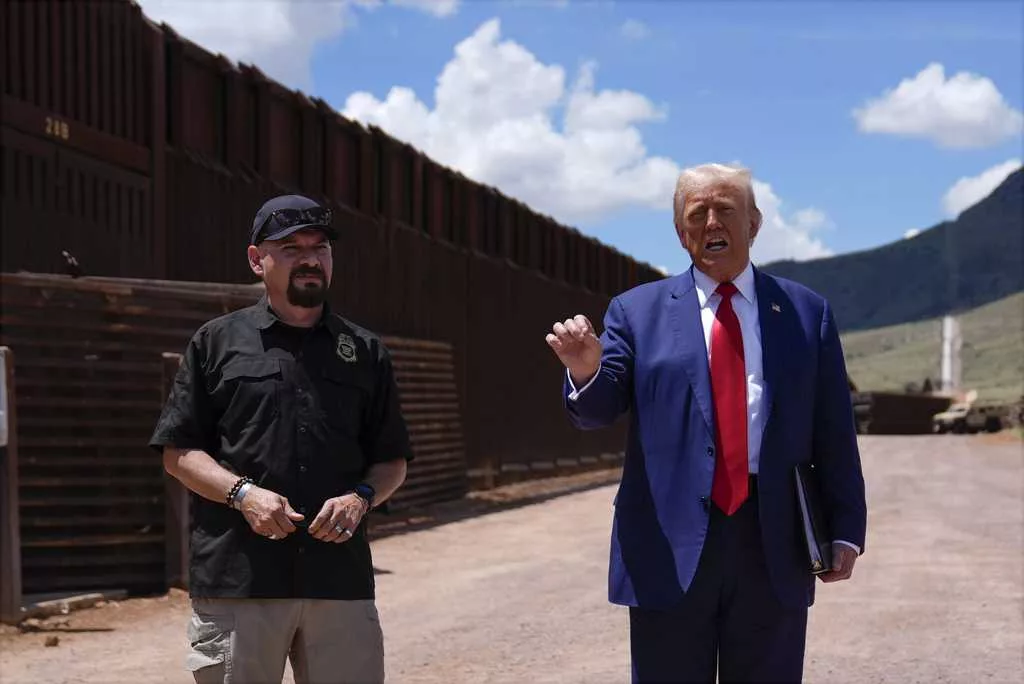 Trump uses a stretch of border wall and a pile of steel beams in Arizona to contrast with Democrats