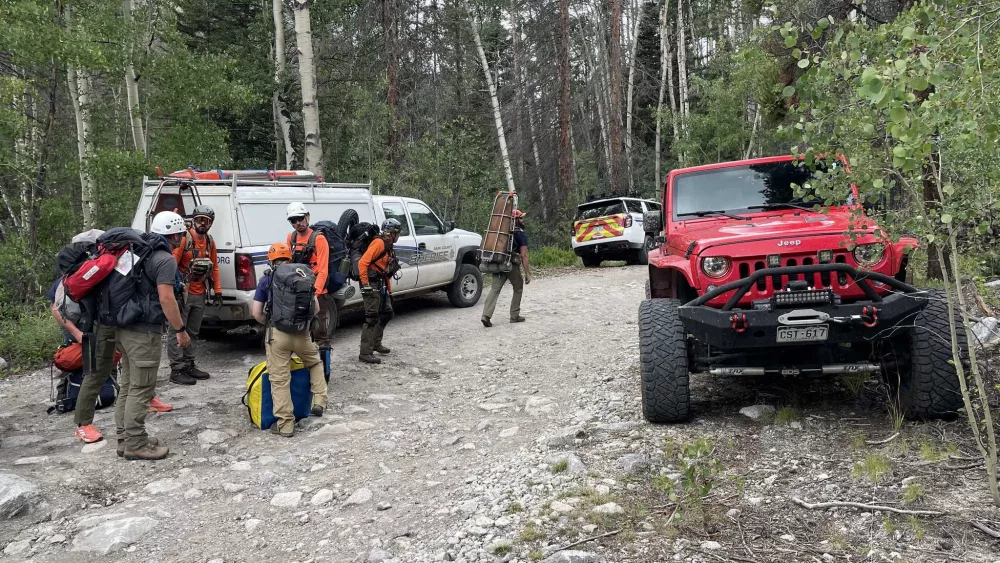 Hiker left on Colorado mountain by coworkers stranded overnight in freezing rain, high winds