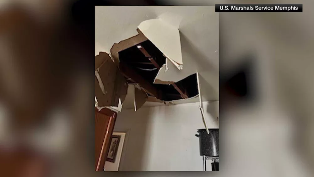 Fugitive murder suspect falls through ceiling trying to evade US marshals