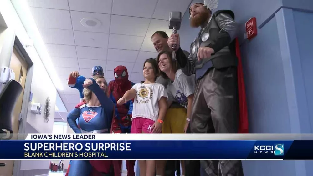 Caped crusaders clean windows, bring joy to kids at Iowa children's hospital