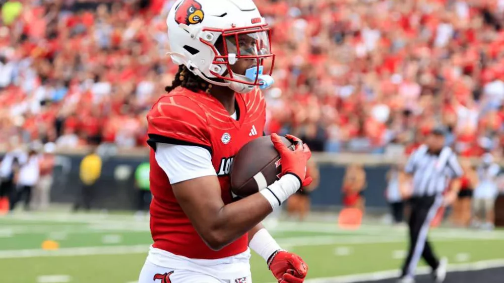 Louisville receiver catches 2 TD passes one year after heroic rescue