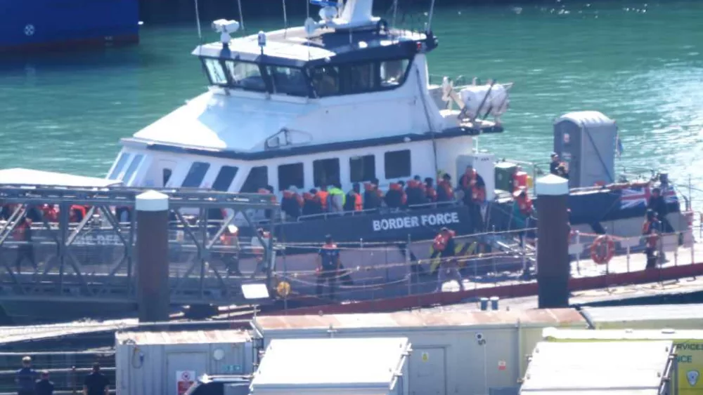 At least 13 are dead after a boat with dozens of migrants rips apart in waters off northern France