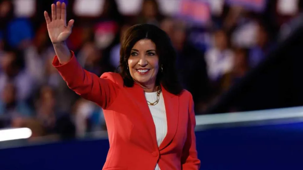 Former aide to New York's governor is charged with being an agent of the Chinese government