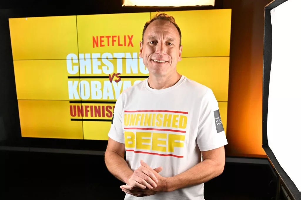 Joey Chestnut breaks own world record, beating rival Takeru Kobayashi