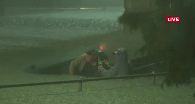 Man saves the life of driver in submerged truck on live television