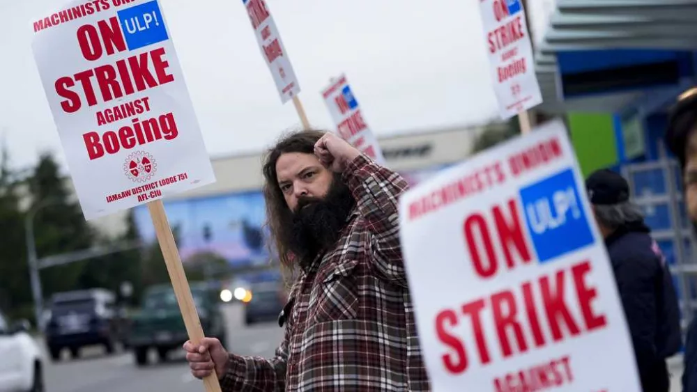 Boeing says it's considering temporary layoffs to save cash during the strike by machinists