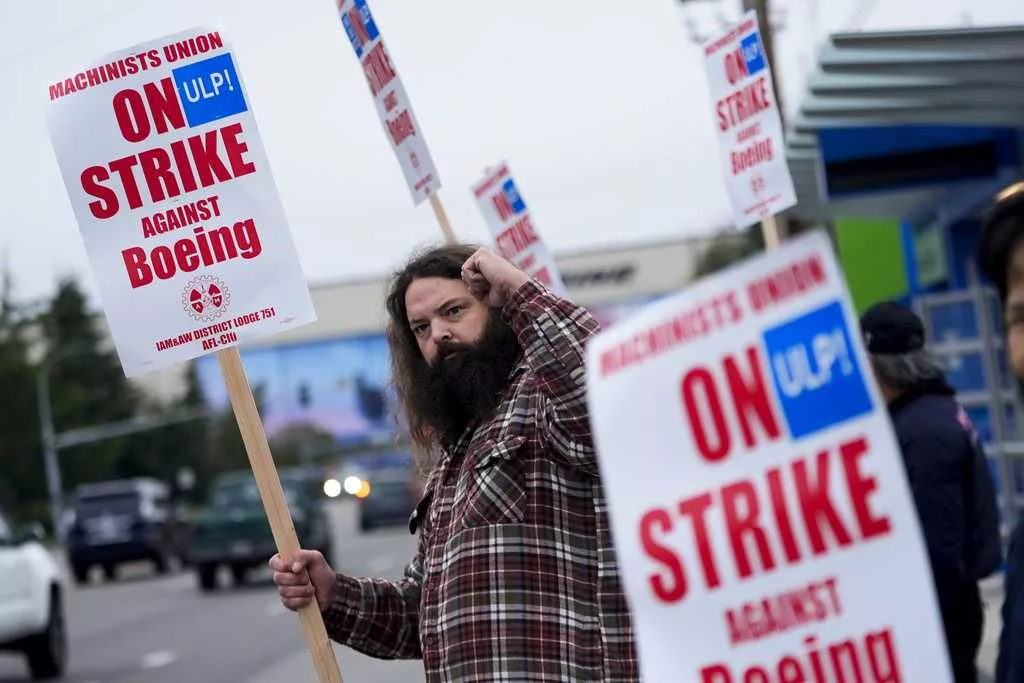 Boeing says it's considering temporary layoffs to save cash during the strike by machinists