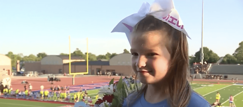 7-year-old girl has dream come true singing national anthem at football game