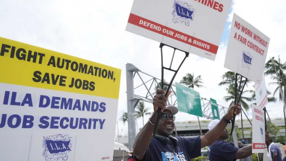 Striking port workers to return to work Friday as negotiators reach an agreement on wages, reports say