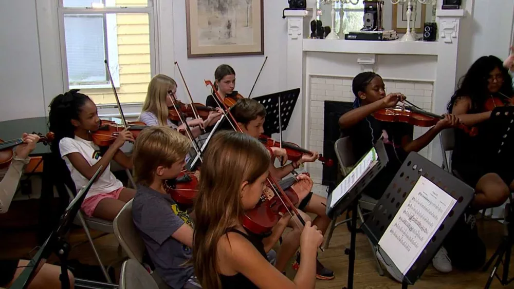 Student musicians rehearse before playing with Savannah Philharmonic