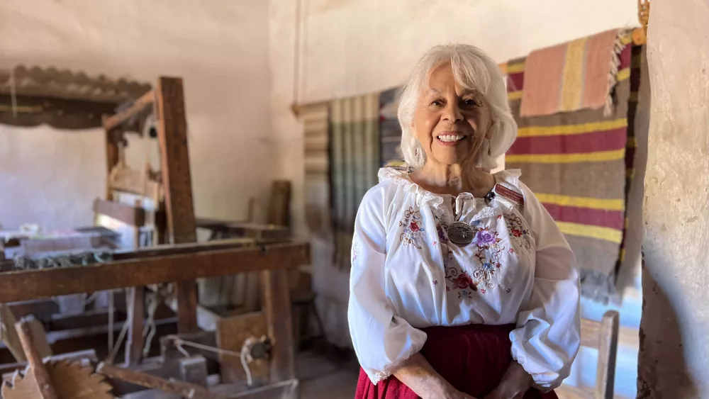 Project CommUnity Elderly volunteer stitches New Mexico's history