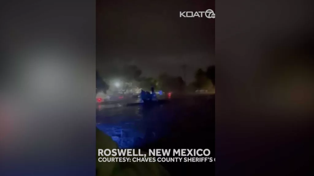 WATCH: New Mexico sheriff stranded on top of police vehicle during flood