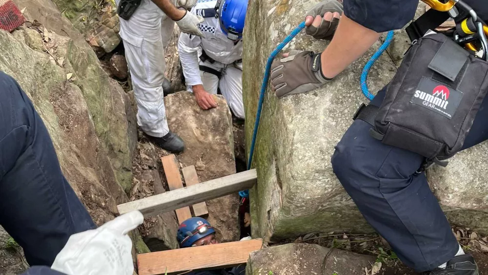 Woman wedged upside down between rocks for 7 hours after trying to retrieve her phone