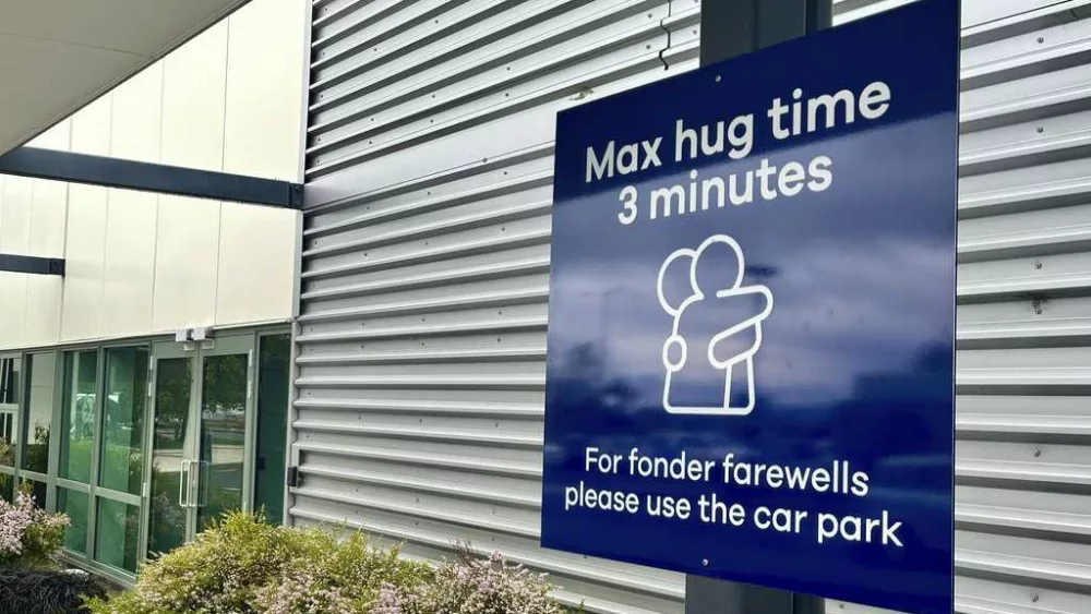 New Zealand airport puts three-minute limit on goodbye hugs