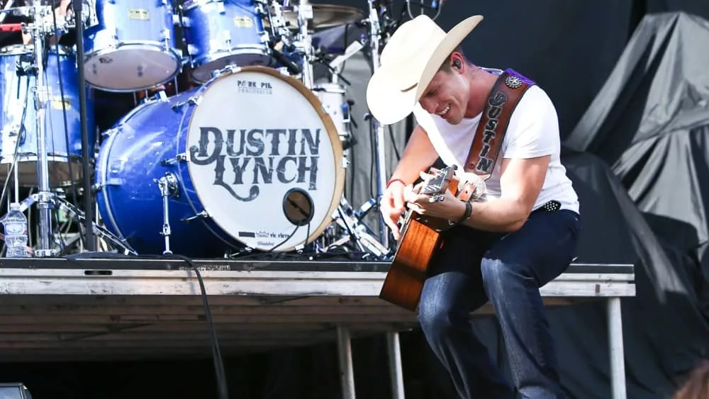 Dustin Lynch performs during the 'Kick The Dust Up' Tour at Vanderbilt Stadium on July 11^ 2015 in Nashville^ Tennessee.