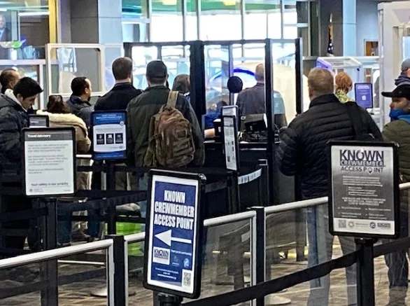 Photo shows passenger security line at Hector International Airport.