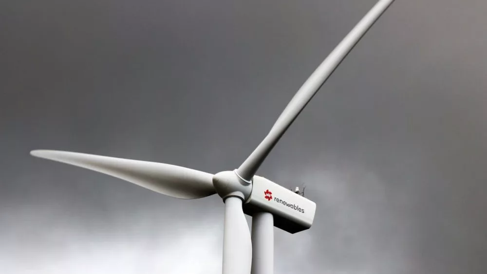 Photo shows closeup image of wind turbine.