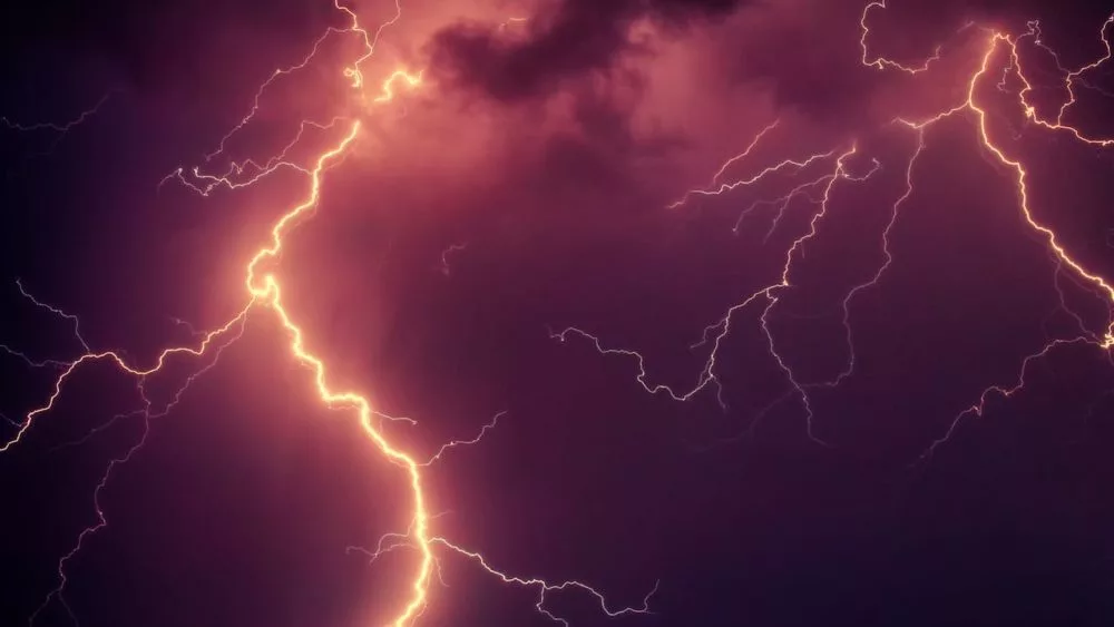 Photo shows lightning in the sky.