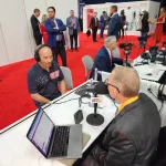 Lee Greenwood is interviewed by The Flag's Scott Hennen at the 2024 Republican National Convention / Photo by Flag Family Media