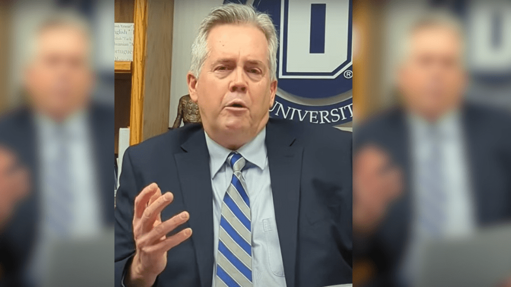 Dickinson State University President Stephen Easten speaking in speaks after stepping down