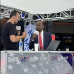 Charlie Kirk interviews Dr. Ben Carson outside the 2024 RNC / Photo by Flag Family Media
