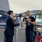 Charlie Kirk broadcasts outside of the 2024 RNC / Photo by Flag Family Media