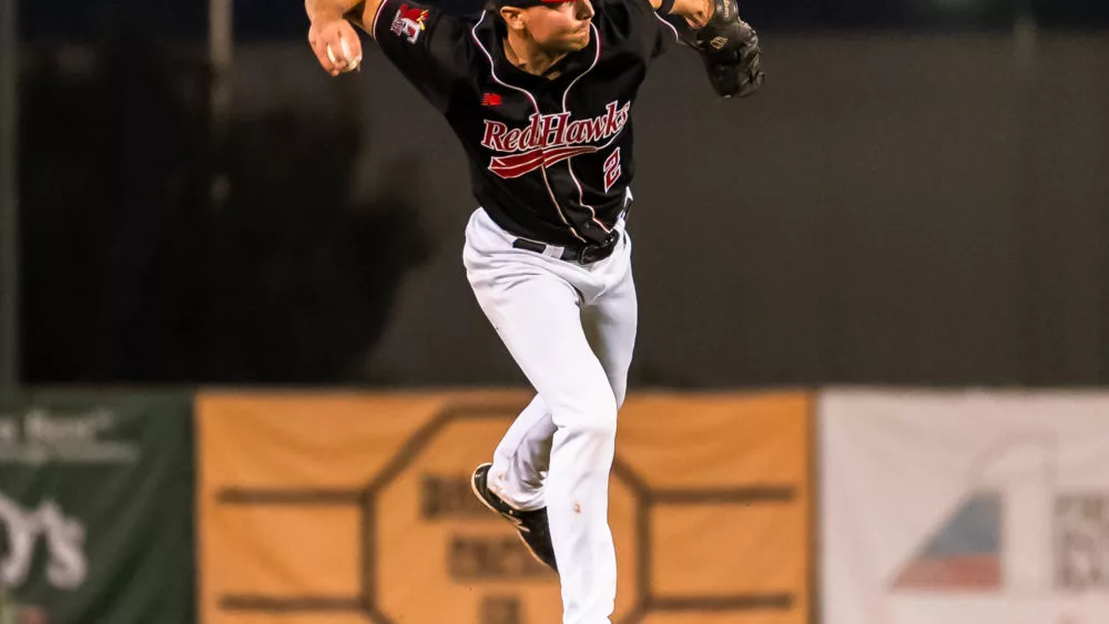 RedHawks shortstop Sam Dexter throwing a baseball