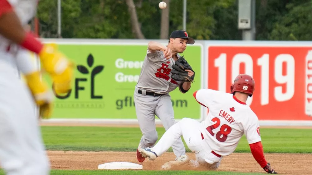 infielder throwing baseball