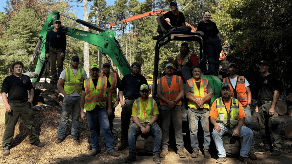 Multiple Minnesota Department of Transportation workers pose after assisting with Hurricane relief efforts