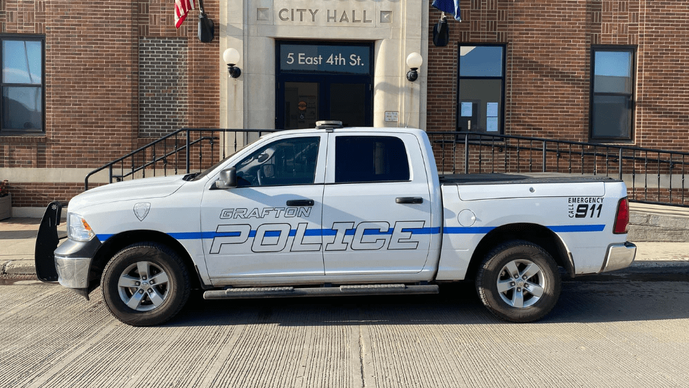 a police pickup outside of a city building