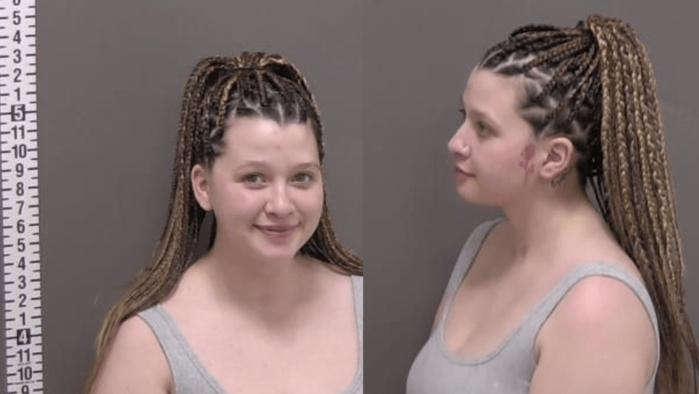 a woman in a mugshot