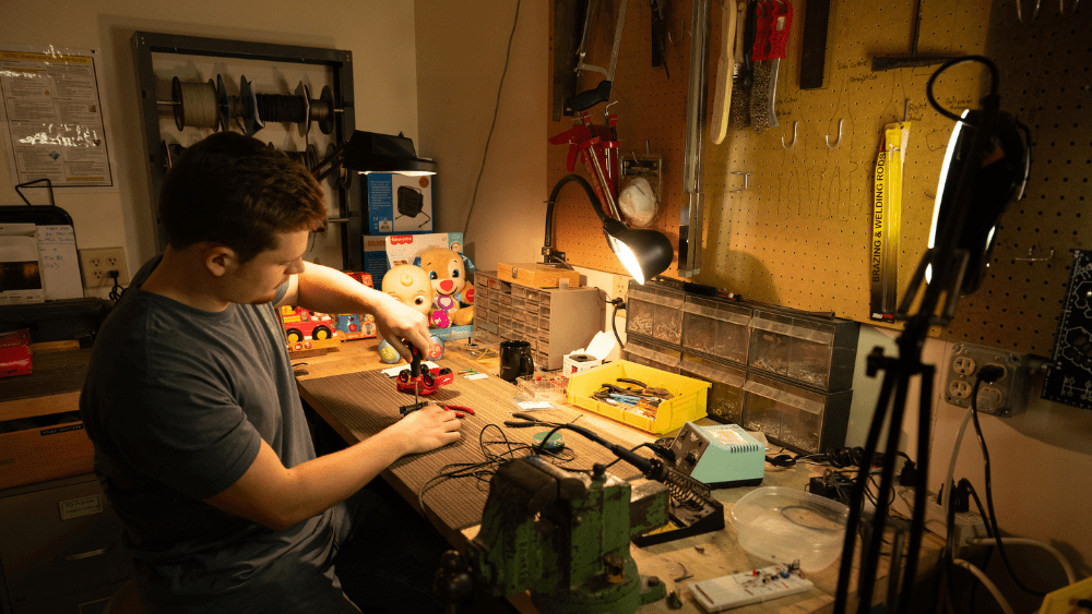 A man works on a toy