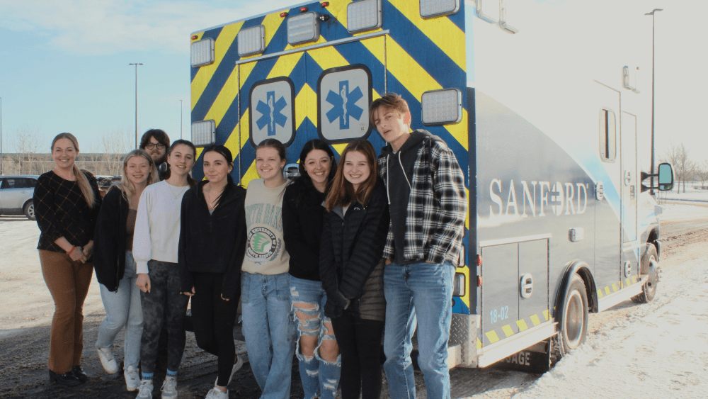 people in front of an ambulance