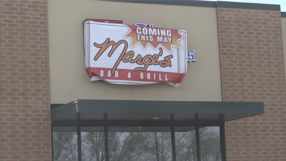 Image of sign above West Fargo storefront that reads "Coming in May. Marge's Bar & Grill"