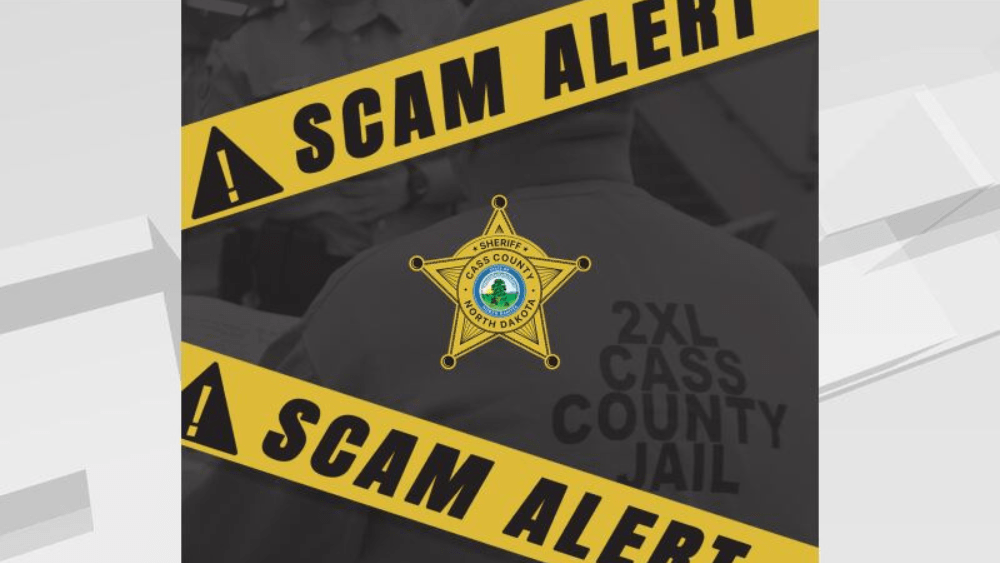 Image of Cass County Sheriff star with "scam alert" yellow tape