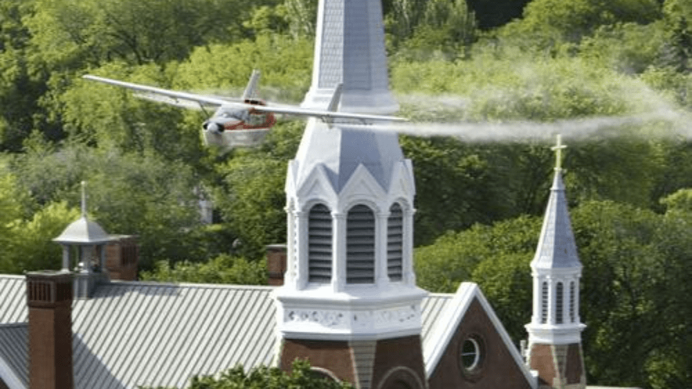 Image of plane conducting aerial bug spraying