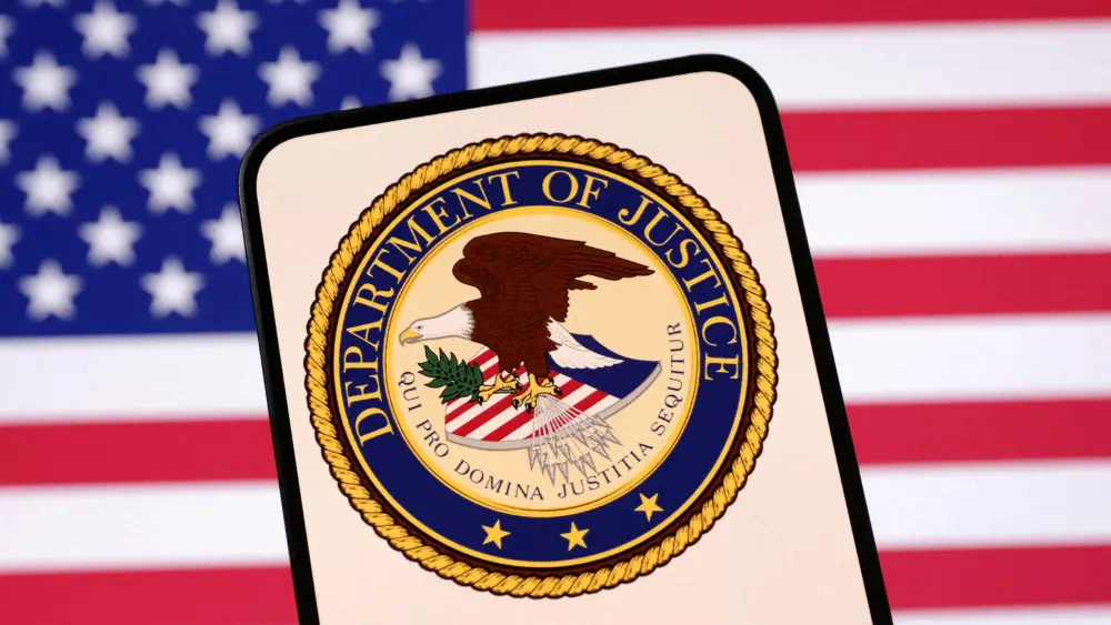 Image of U.S. flag with Department of Justice insignia in the foreground (REUTERS)