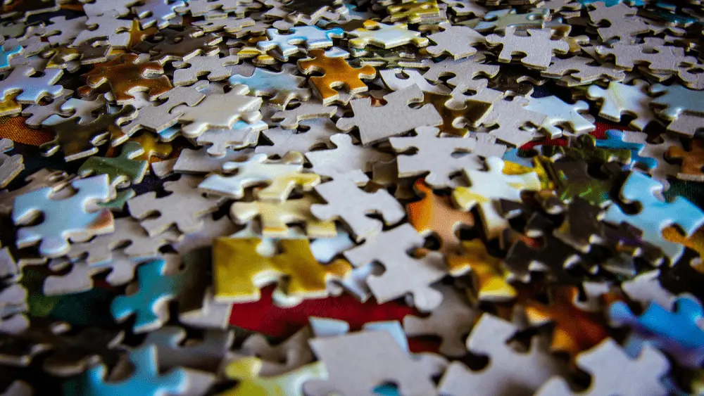 Generic image of puzzle pieces spread across a flat surface