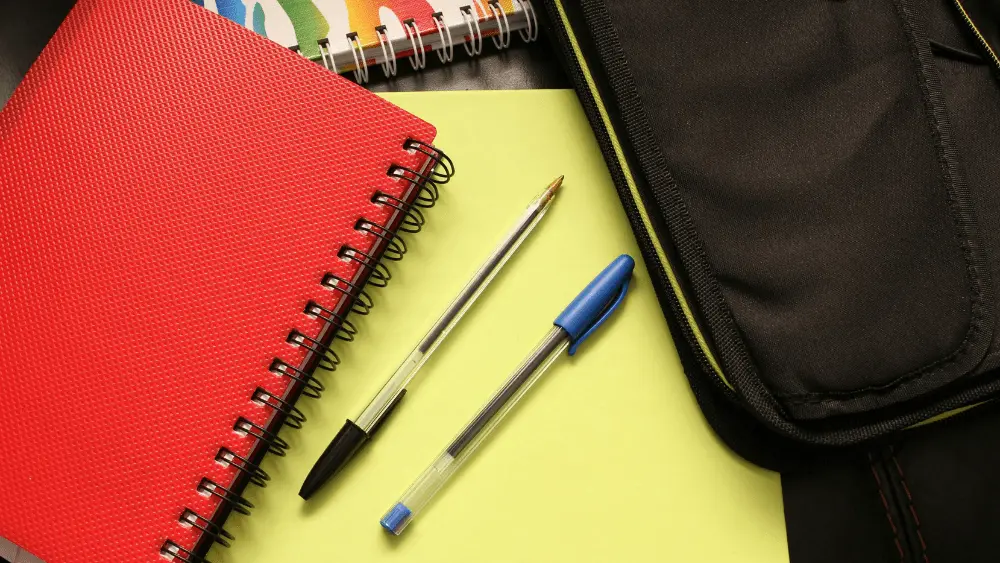 Image of pens and notebooks