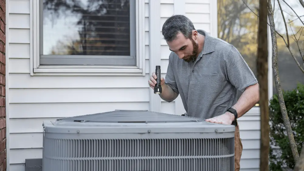 Image of generic HVAC repairman checking out a system